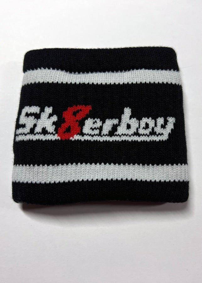 bandeau noir avec empreinte de patte de chien sur le devant en blanc avec logo sk8erboy au dos, tricoté pour bras et jambes avec poche intérieure