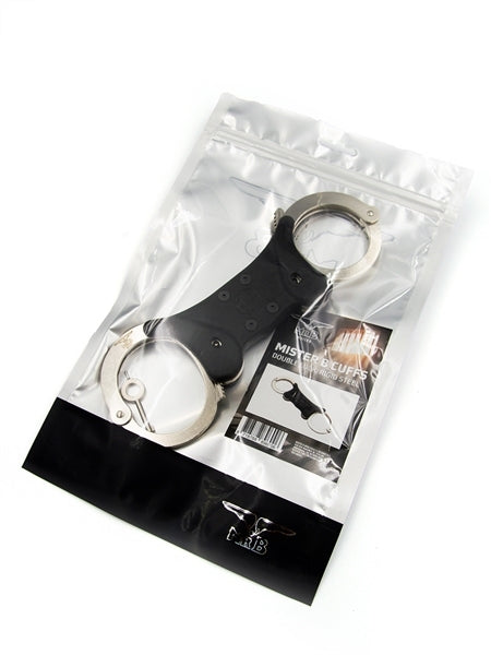 Mister B Handschellen aus vernikeltem Stahl und zwei schlüssel bei sk8erboy im shop für bdsm und gay bondage verpackt